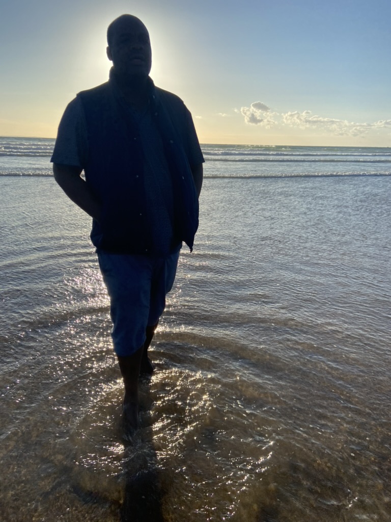 Developer Profile - Silhouette on beach at sunset